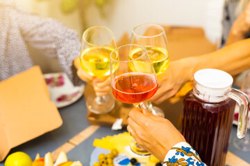 Celebration. People holding glasses of white wine making a toast