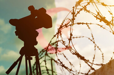 Double exposure - camera, barbed wire and flag Algeria