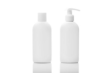 White plastic cosmetics bottles with reflection isolated on white