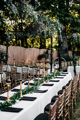 Tables set for outdoor wedding reception 