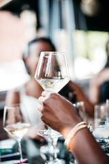 glass of champagne raised in a toast at a wedding