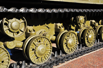 Tank tracks and tracks. Close-up of a tank track and wheels. Old military equipment