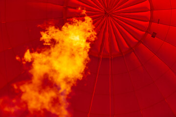 The inside of a hot air balloon as it is inflating.