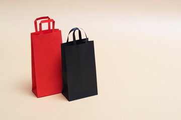 Black friday concept, mockup of paper black and red packages on colored background. Black Friday. With copy space