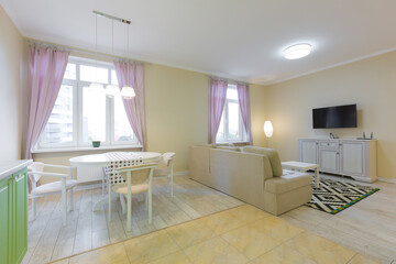 living room interior, with large sofa and TV, with purple curtains, modern style in light colors