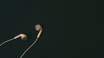 view of headphones on black background