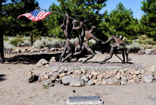 Weed, Califorina: Living Memorial Sculpture Garden Dedicated to all Veterans by artist Dennis Smith. Sculpture with soldiers raising the American flag called "The Greatest Generation" 