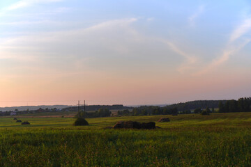 sunset over the field of hays