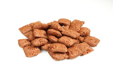 Pile of chocolate pillows isolated on white background.Dry crispy dessert