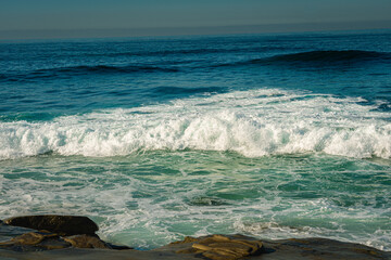 2021-09-21 WAVES AND SURF APPROACHING THE ROCKS IN LA JOLLA CALIFORNIA