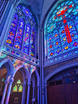 Stained glass windows, beautiful interior of the basilica of Pontmain, northern France.
