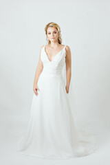 Fototapeta na wymiar blonde caucasian bride on white dress bridal dress concept