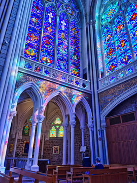Stained glass windows, beautiful interior of the basilica of Pontmain, northern France.