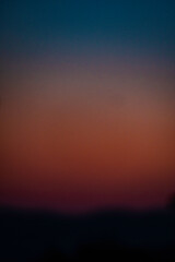 texture of a multicolored sunset with blur during a summer evening in Liguria
