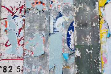 Detail of Billboard with remnants of layered, torn and peeled billboard 