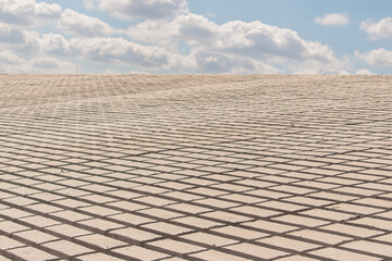 Matching concrete brick landscape with blue sky