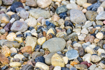 Rocks sea beach or stones background, Many small stones in assorted colors, Abstract rough wallpaper nature concept
