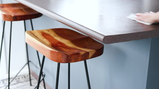 disinfecting surfaces from bacteria or viruses in your home or business, hand cleaning bar table with disinfectant wet wipe