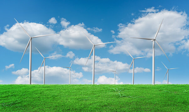 Wind turbines field against blue sky background. Windmill, eco power. Green energy technology concept