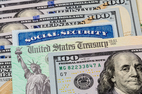 Social Security card, treasury check and 100 dollar bills. Concept of social security benefits payment, retirement and federal government benefits