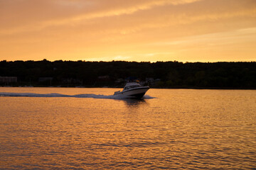 Beautiful sunset reflecting on the water while sailing at Narragansett Bay, Rhode Island USA