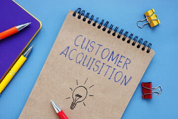 Business concept meaning Customer Acquisition with inscription on the sheet.