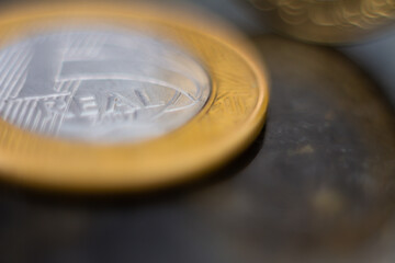 Close-up of gold and silver coins in common use.