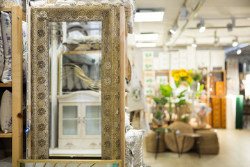 Mirror in original design frame in a hardware store