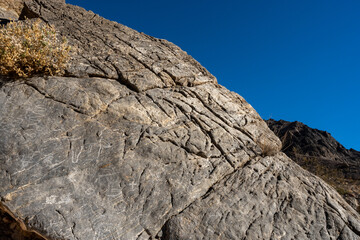 Graffiti And Petroglyphs In The Bright Morning Sun of Titus Canyon