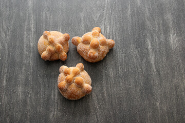 Fluffy, sugary, fresh and delicious Mexican pan de muerto for the season of the traditional holiday of the Day of the Faithful Dead and All Saints in November
