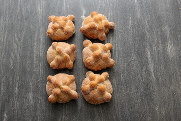 Fluffy, sugary, fresh and delicious Mexican pan de muerto for the season of the traditional holiday of the Day of the Faithful Dead and All Saints in November
