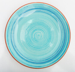 View of empty round blue plate on white table