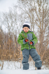 Fototapeta na wymiar portrait of a boy in the winter forest