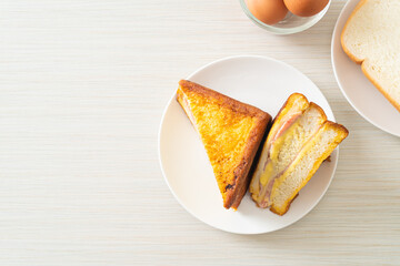 sandwich ham cheese on white plate