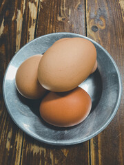 A group of raw egg in aluminum dish