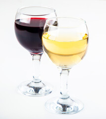 red and white wine in transparent glasses on a white background