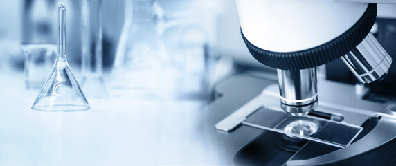 microscope in medical science lab white blue banner background