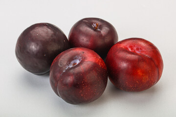 Ripe sweet plum fruit heap