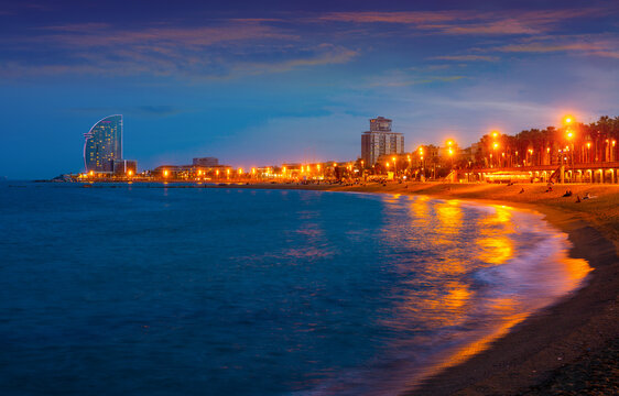 Evening view of the beach of Barceloneta - a lively quarter of the Old City of Barcelona, popular with locals and tourists