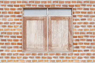 Old wooden window on brick wall texture background