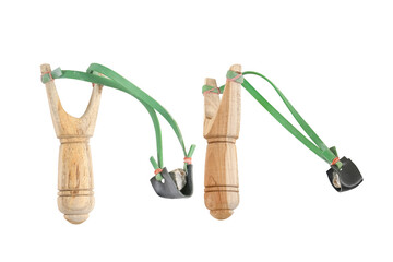 Handmade wooden slingshot or catapult with stone bullet Isolated on white backgroun with clipping...