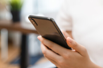 Close up image of hand holding a smartphone.