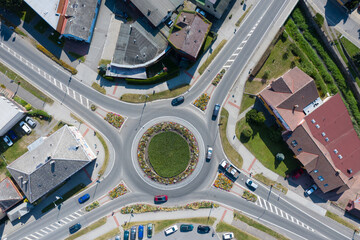 Aerial view of roundabout traffic with cars.
Infrastructure from above.
