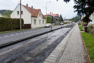 Workman working on new asphalt. Laying the next layer of asphalt in the construction of a new road....