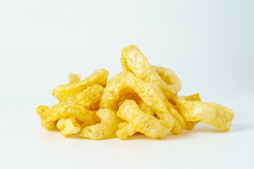 Pork snack or pork rind isolated on white background. Close up of fried  crispy pork skin. 