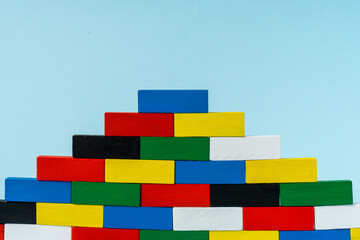 Stack of colorful wooden cuboid shape perfect for background.