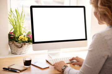 Woman working with desktop computer at home or office, screen mockup