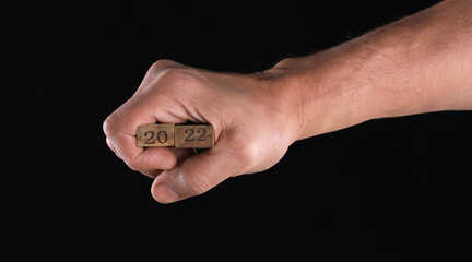 wooden numbers 2022 in hand