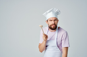 a man in a chef's uniform with a spoon in his hands cooking emotions