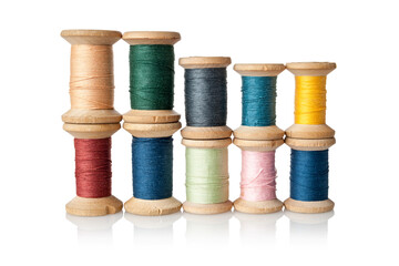 Many different, multi-colored coils, bobbins, skeins of thread for sewing and embroidery, weaving, tailor skills, hobbies, isolated on a white background